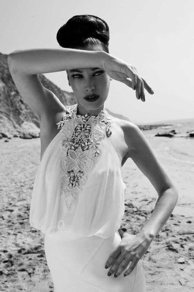 Bride on a rocky beach, beaded halter gown