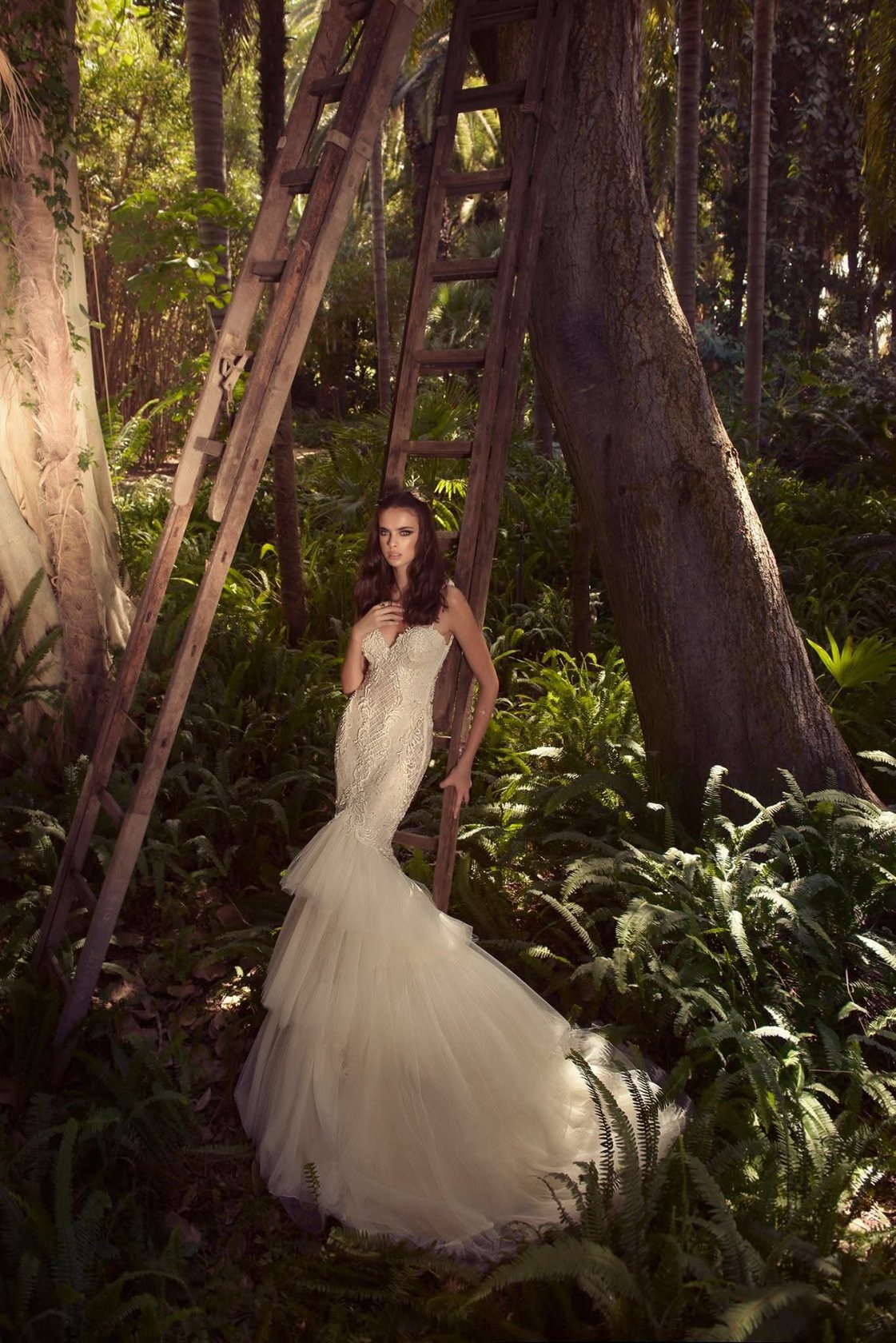 Bride in a palm forest, lace mermaid gown