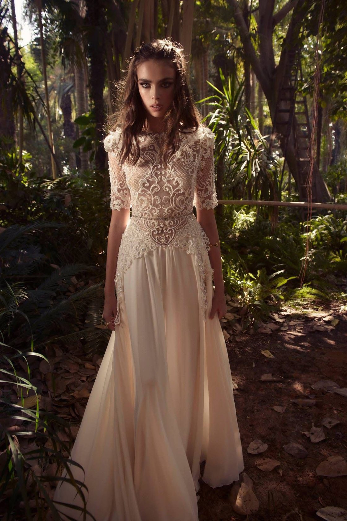 Bride in a palm forest, embroidered gown