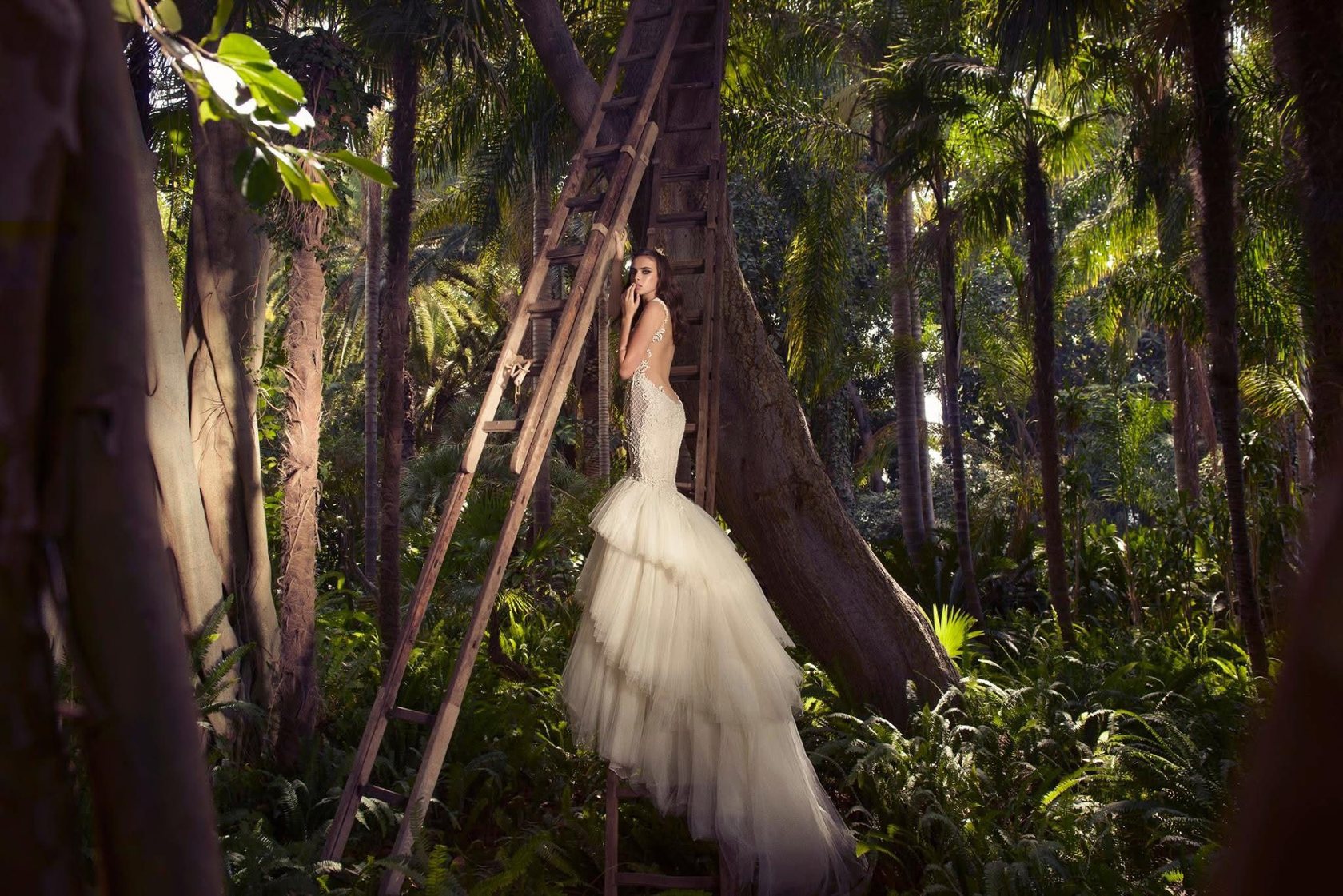 Bride in a palm forest, open-back mermaid gown