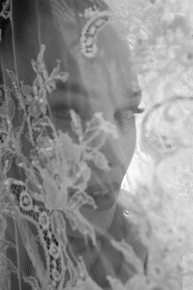 Bride behind a lace veil